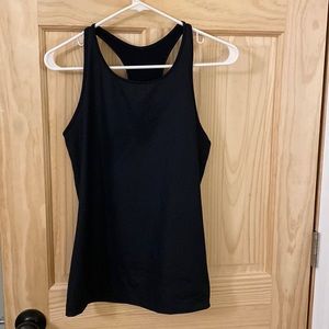 Underarmour tank.  Flattering. Slimming